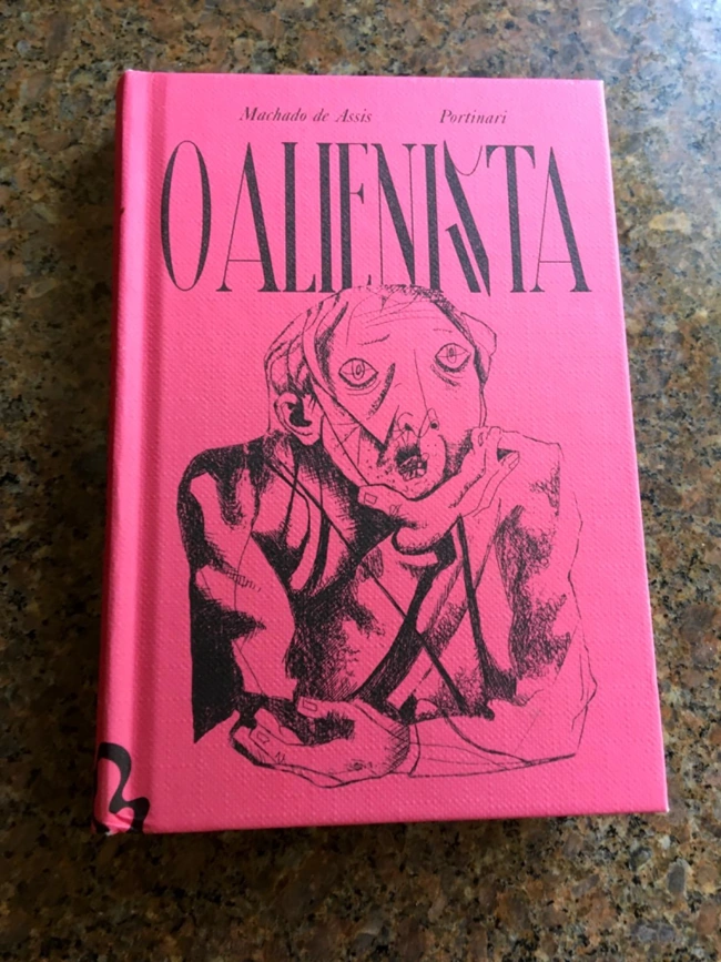 Capa da versão premium de O Alienista. Recomendando livros curtos para ler em um dia.